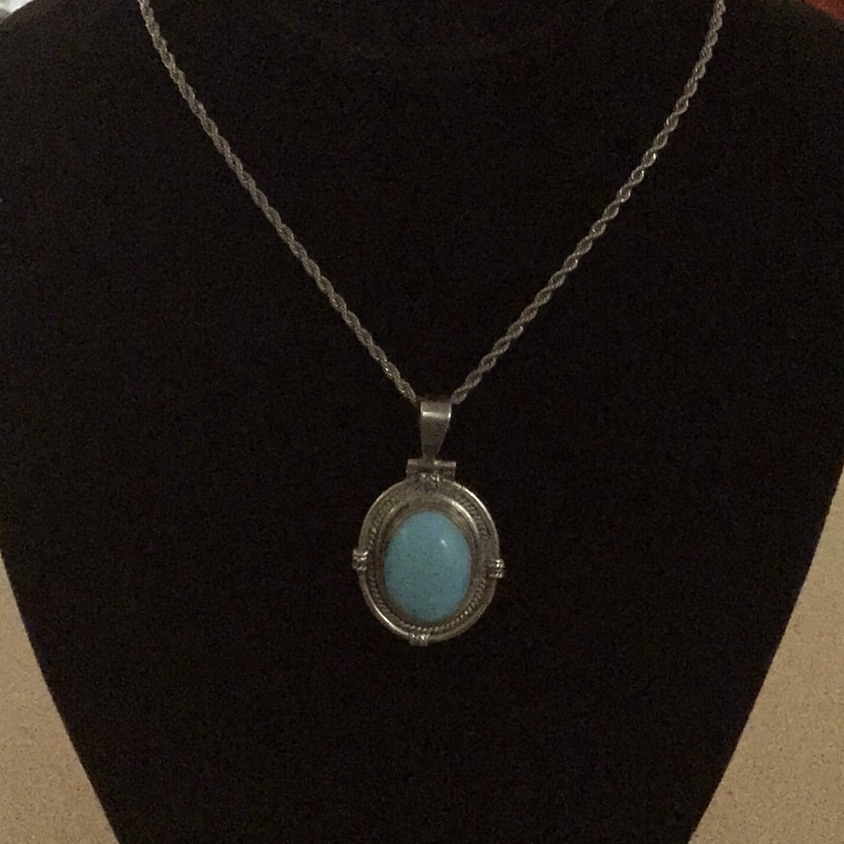 Turquoise Stone Cast In Sterling Silver W/ Stainless Steel Chain.